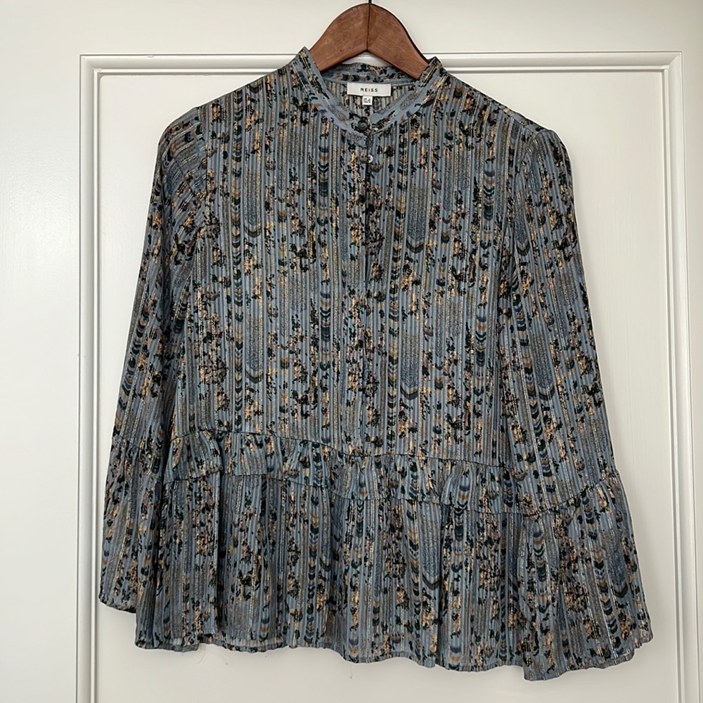 Reiss blouse. Light blue with darker blue, gold, and green  pattern. 5 buttons